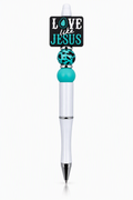 Love Like Jesus beaded pen with white body, teal silicone bead, teal leopard print bead, silver spacer, and black square charm