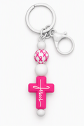Pink Jesus cross keychain with white beads, pink ribbon-patterned bead, silver-tone key ring and lobster clasp