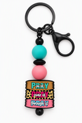 Prayer keychain with pink, turquoise, and black beads, a leopard-print accent, black key ring, and lobster clasp